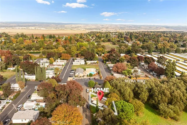 an aerial view of a pool patio yard and outdoor seating