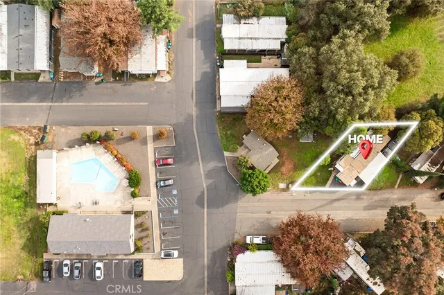 an aerial view of residential building with outdoor space and swimming pool