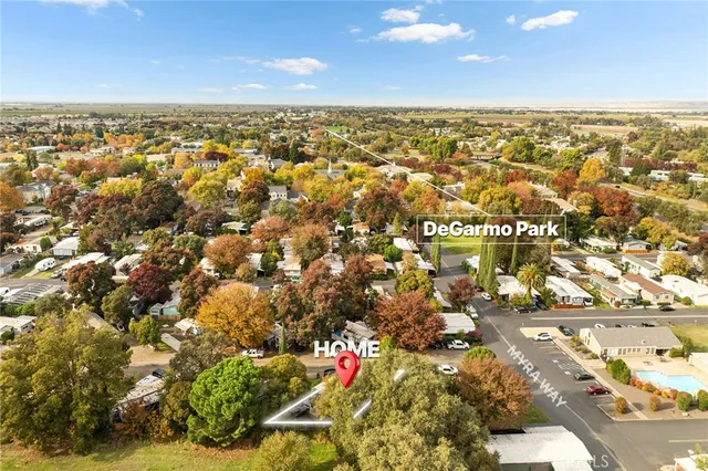 a view of a house with swimming pool and sitting area