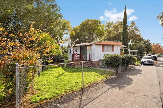 a view of street with yellow house