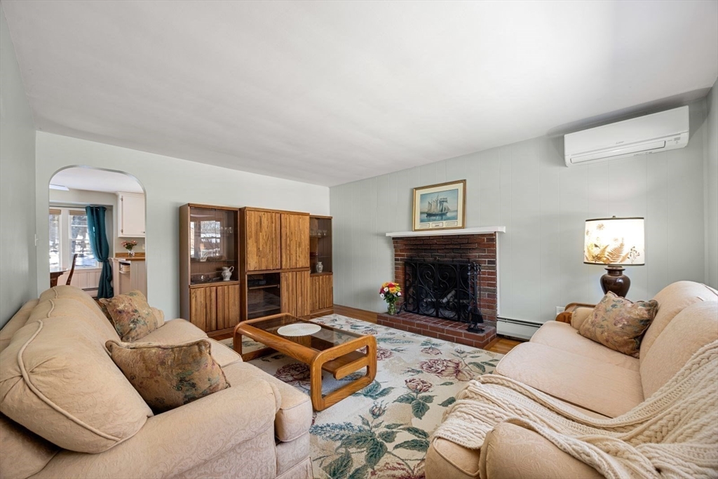 6 Cross Street Foxboro, MA 02035 - Photo 12 of 26 a living room with furniture and a fireplace