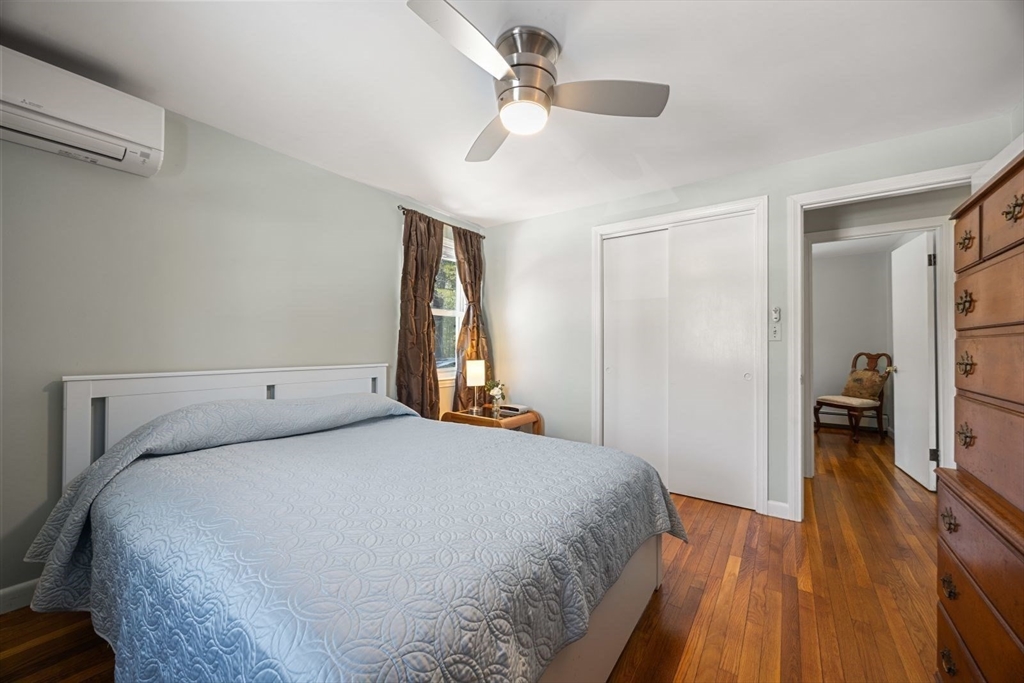 6 Cross Street Foxboro, MA 02035 - Photo 15 of 26 a bedroom with a bed and a walk in closet