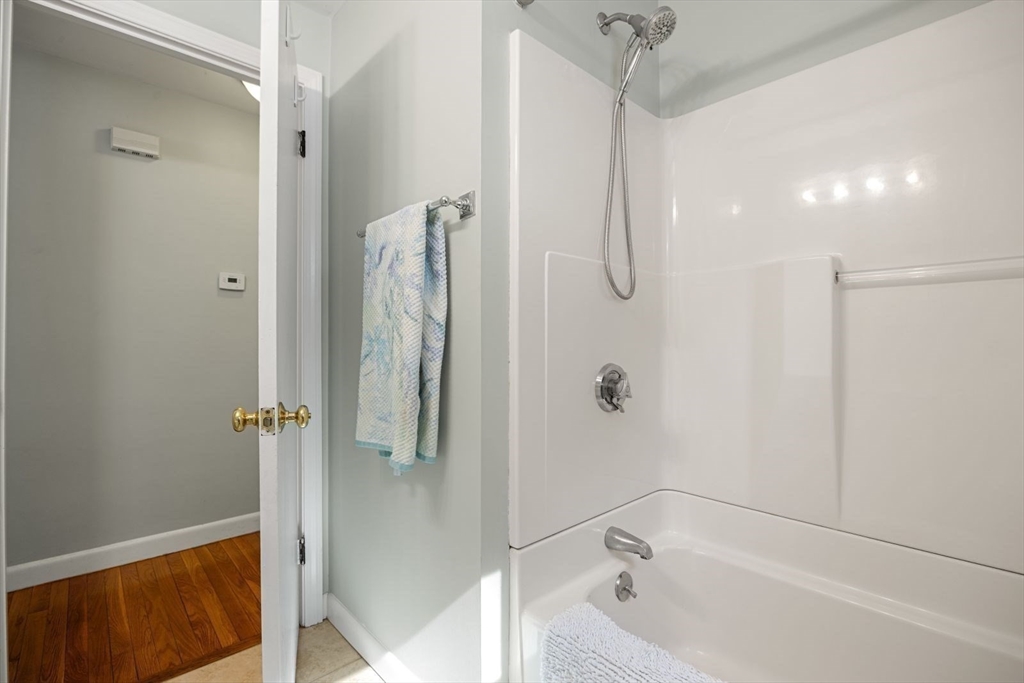 6 Cross Street Foxboro, MA 02035 - Photo 18 of 26 a bathroom with a tub and shower