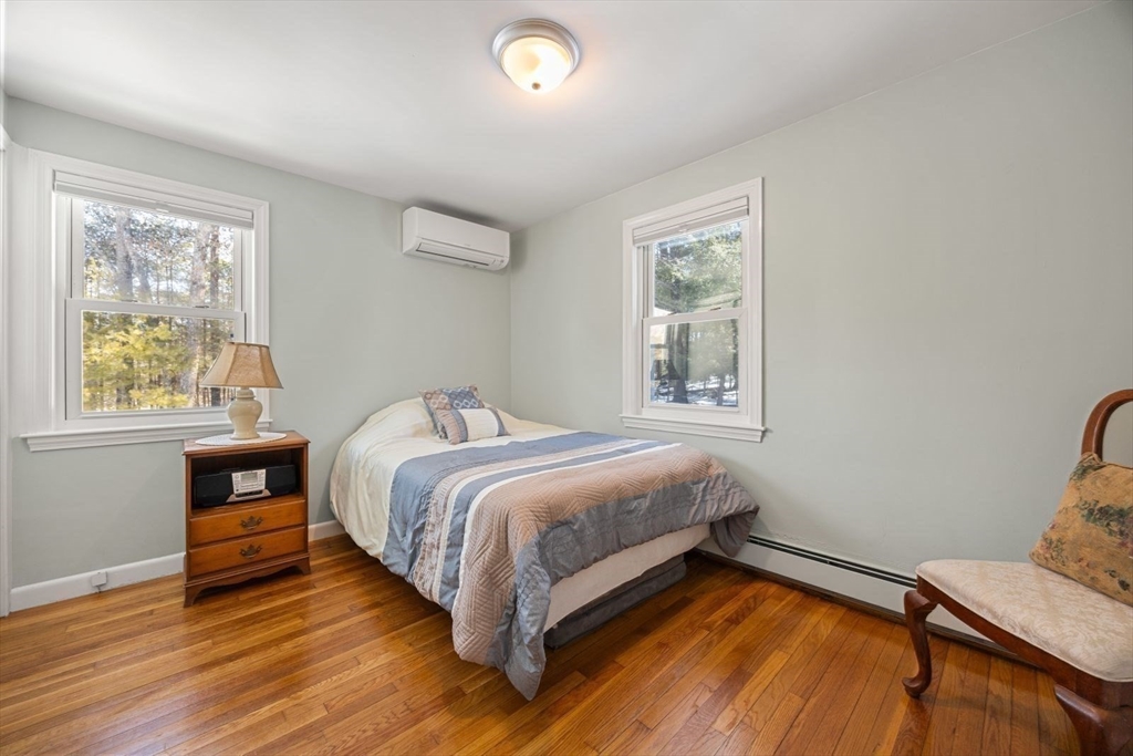 6 Cross Street Foxboro, MA 02035 - Photo 19 of 26 a bedroom with a bed and wooden floor