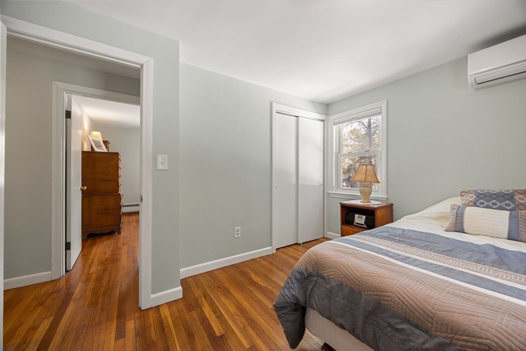 6 Cross Street Foxboro, MA 02035 - Photo 20 of 26 a bedroom with a bed and wooden floor
