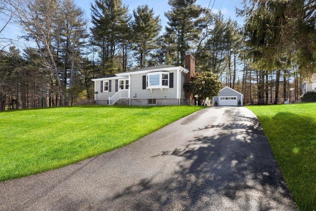 6 Cross Street Foxboro, MA 02035 - Photo 2 of 26 a front view of a house with a yard and trees