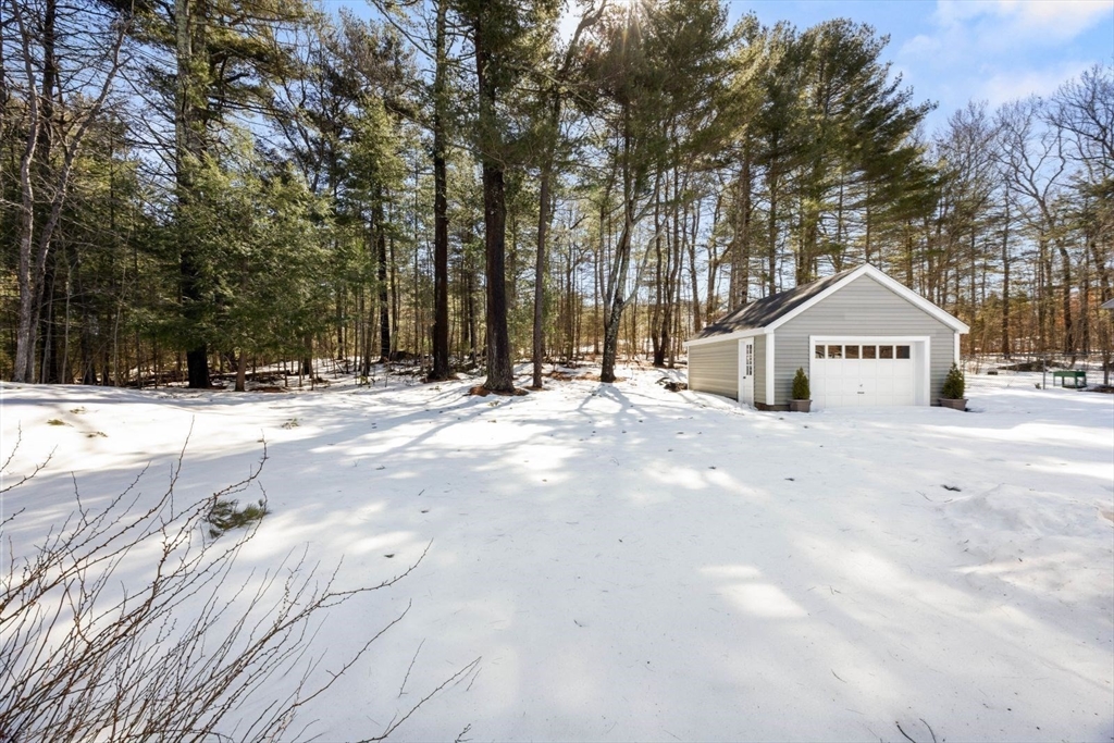 6 Cross Street Foxboro, MA 02035 - Photo 24 of 26 a view of white house with a yard covered in snow