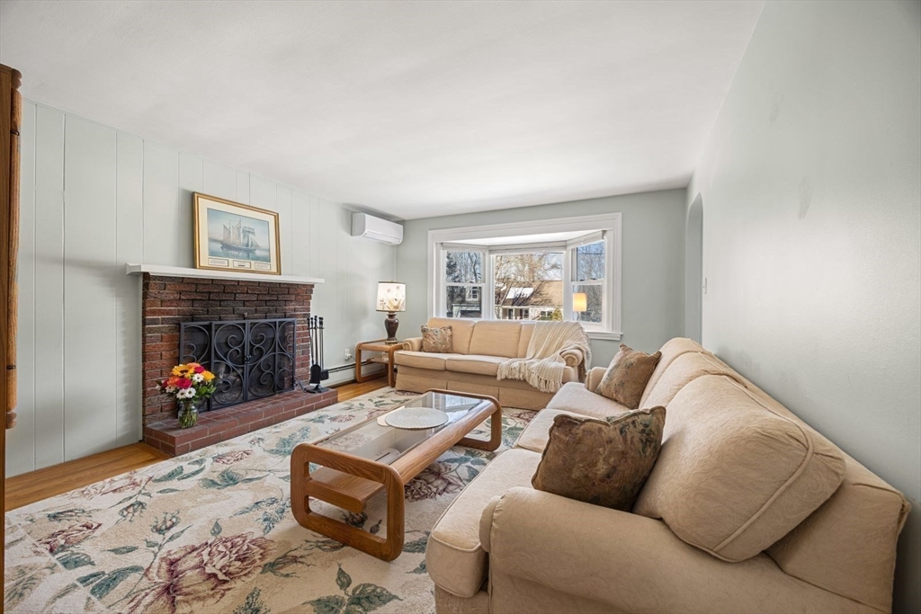 6 Cross Street Foxboro, MA 02035 - Photo 9 of 26 a living room with furniture a fireplace and window