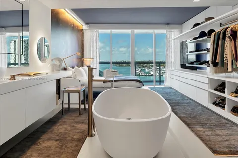 a living room with furniture cabinets and a book shelf