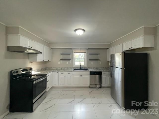 3927 Flat Creek Road Lancaster, SC 29720 - Photo 5 of 15 a kitchen with a stove a refrigerator and a sink
