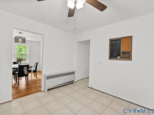 a view of a livingroom with furniture and a window