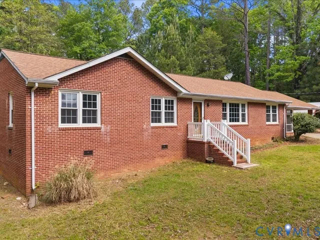 a front view of a house with yard