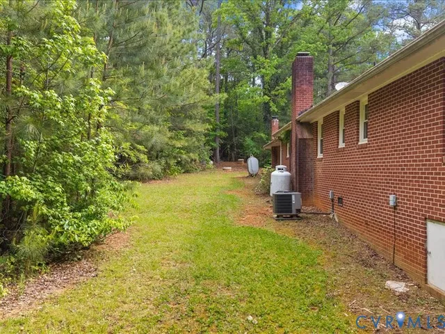 a view of a backyard with sitting area