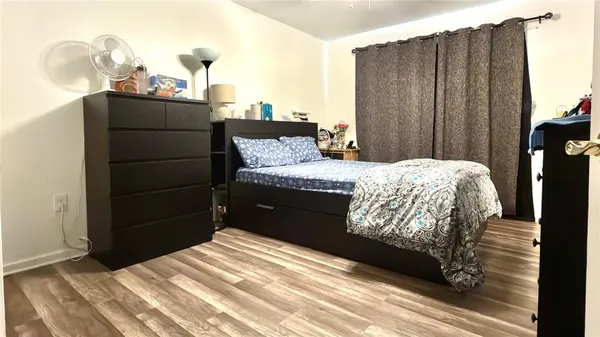 a bedroom with a bed and cabinets