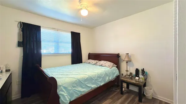 a bedroom with a bed and a table in it