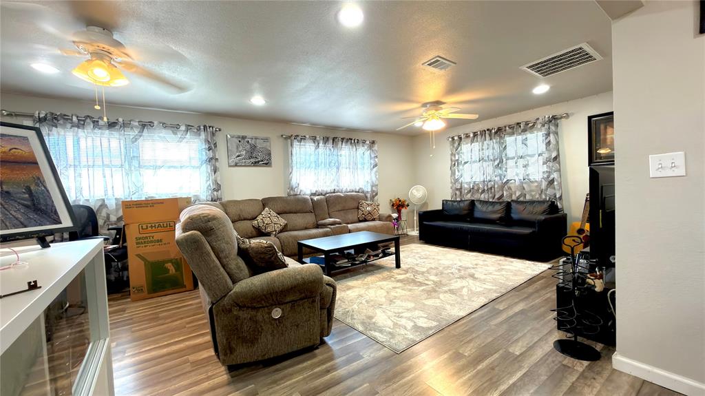 2510 Dewitt Street Irving, TX 75062 - Photo 7 of 17 a living room with furniture and a flat screen tv