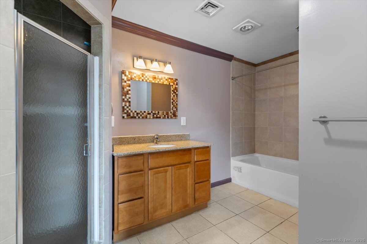 677 Quinnipiac Avenue, Unit 9 New Haven, CT 06513 - Photo 20 of 36 a bathroom with a sink and a mirror