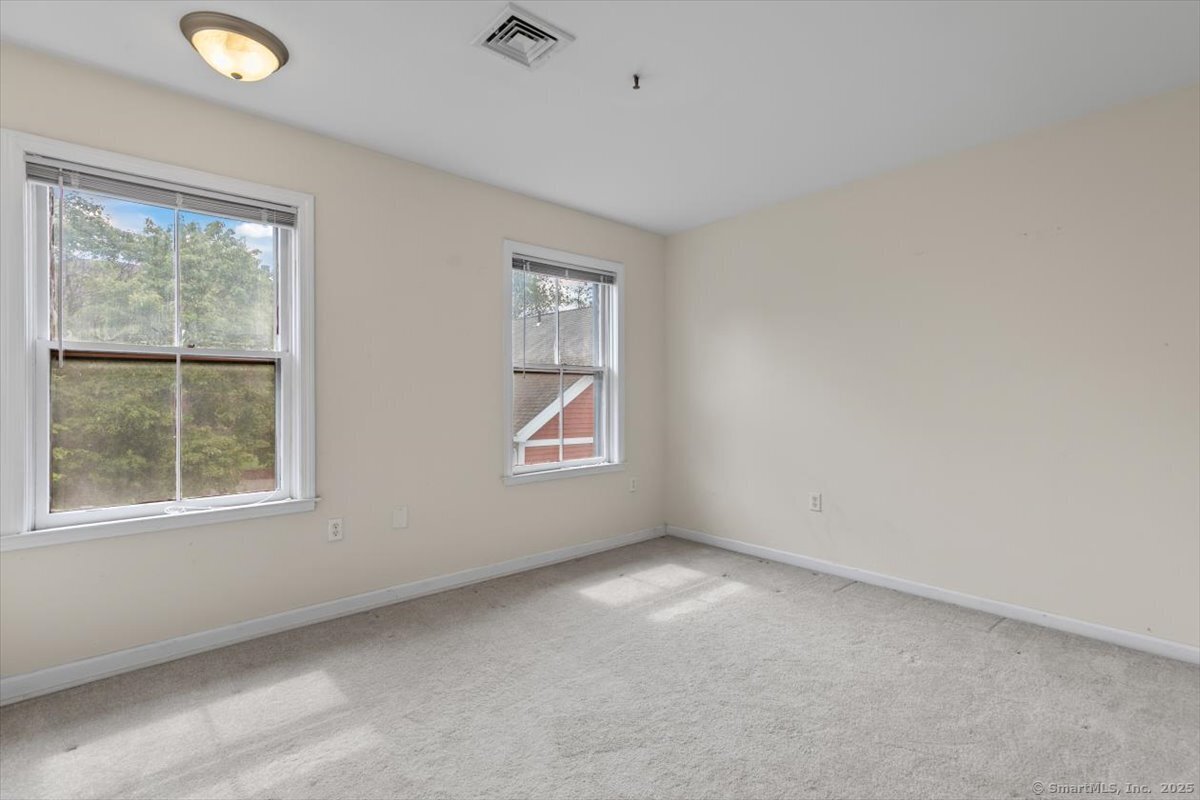 677 Quinnipiac Avenue, Unit 9 New Haven, CT 06513 - Photo 26 of 36 an empty room with a window
