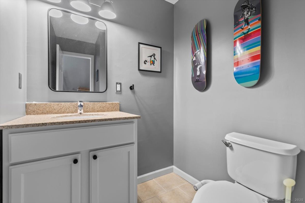 677 Quinnipiac Avenue, Unit 9 New Haven, CT 06513 - Photo 29 of 36 a bathroom with a sink and a mirror