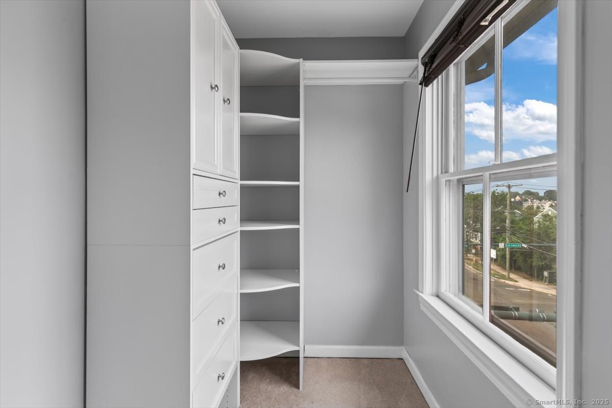 677 Quinnipiac Avenue, Unit 9 New Haven, CT 06513 - Photo 30 of 36 a view of walk in closet with empty racks