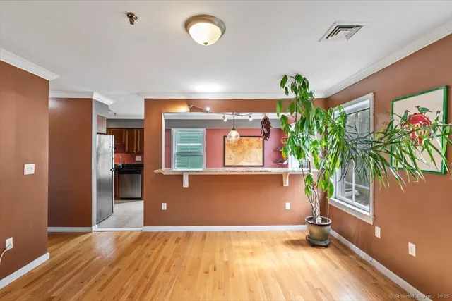 a view of livingroom with furniture and a potted plant
