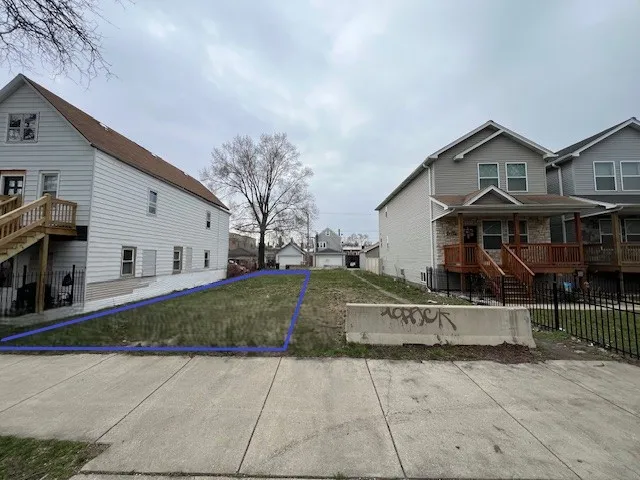 a view of house with outdoor space and parking