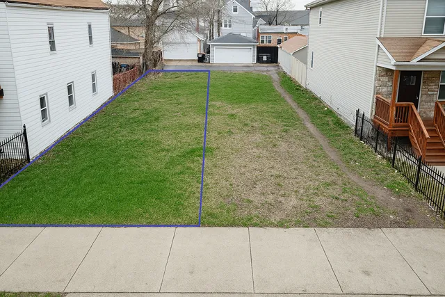 a view of backyard with seating area