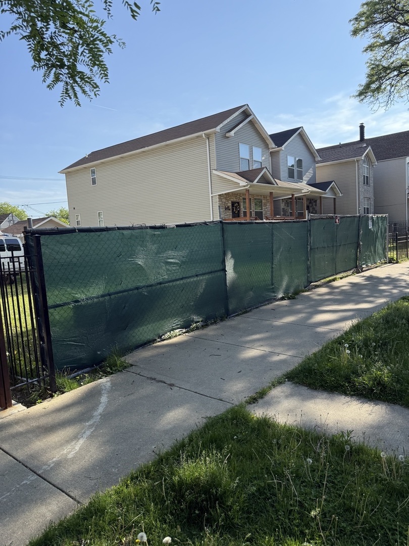 2457 West 46th Place Chicago, IL 60632 - Photo 9 of 9 a front view of a house with a yard and garage