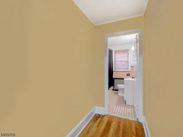a view of a bedroom from a hallway