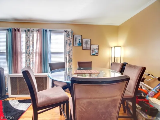 a dining room with a table and chairs