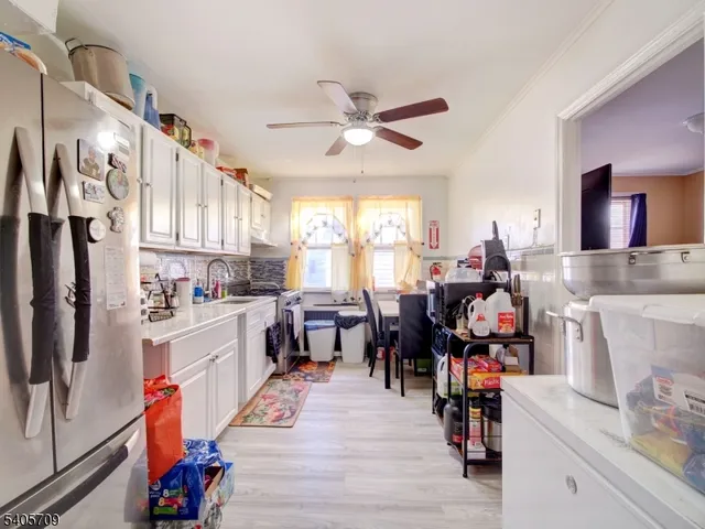 a group of people sitting in a kitchen