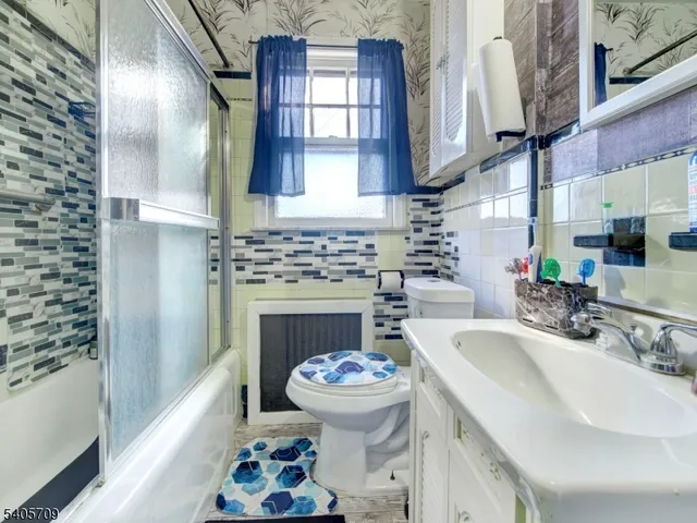 a bathroom with a sink a toilet and a bathtub