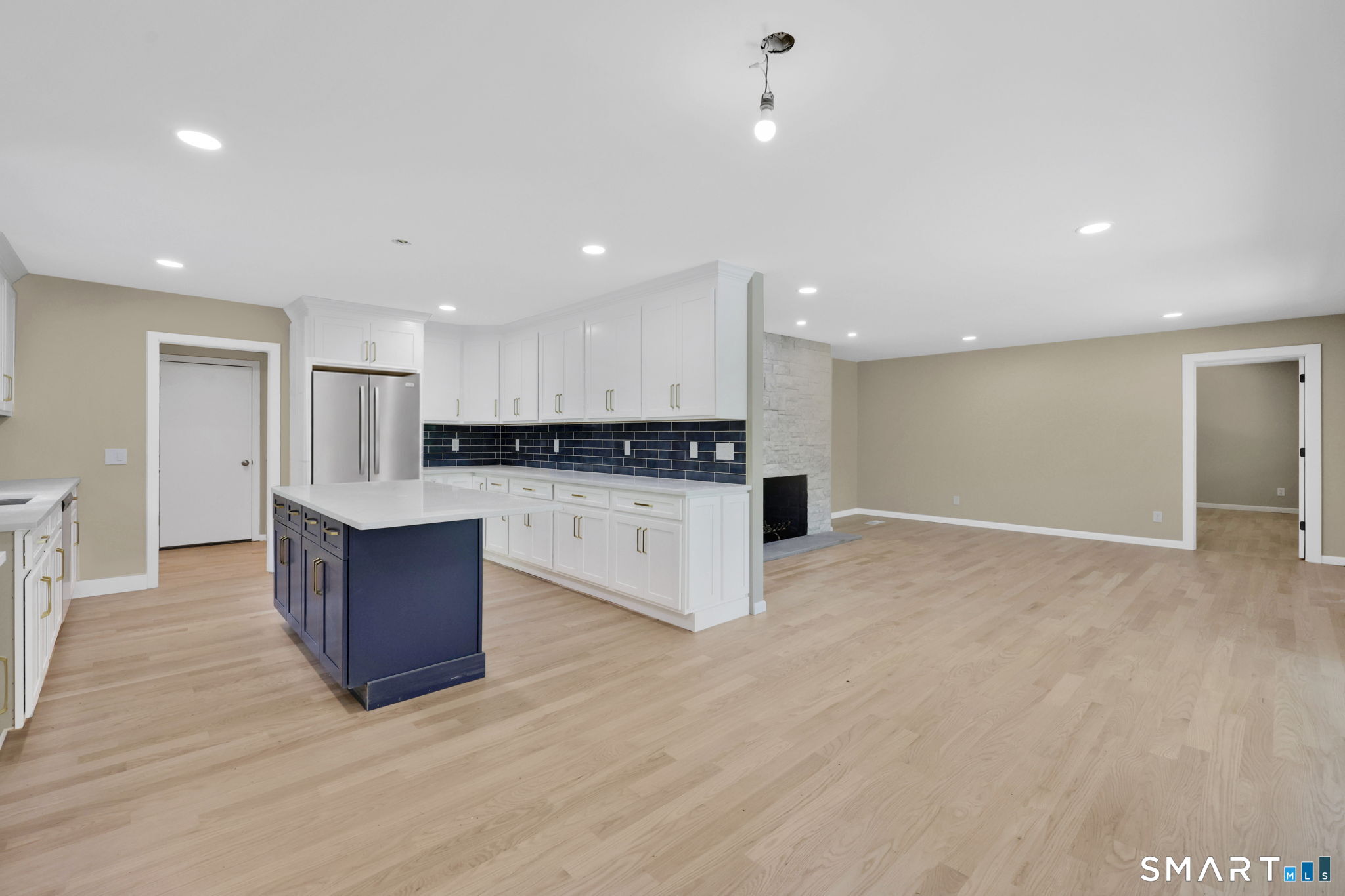 49 Millstone Road Glastonbury, CT 06033 - Photo 6 of 39 a view of kitchen with kitchen island stainless steel appliances cabinets and wooden floor