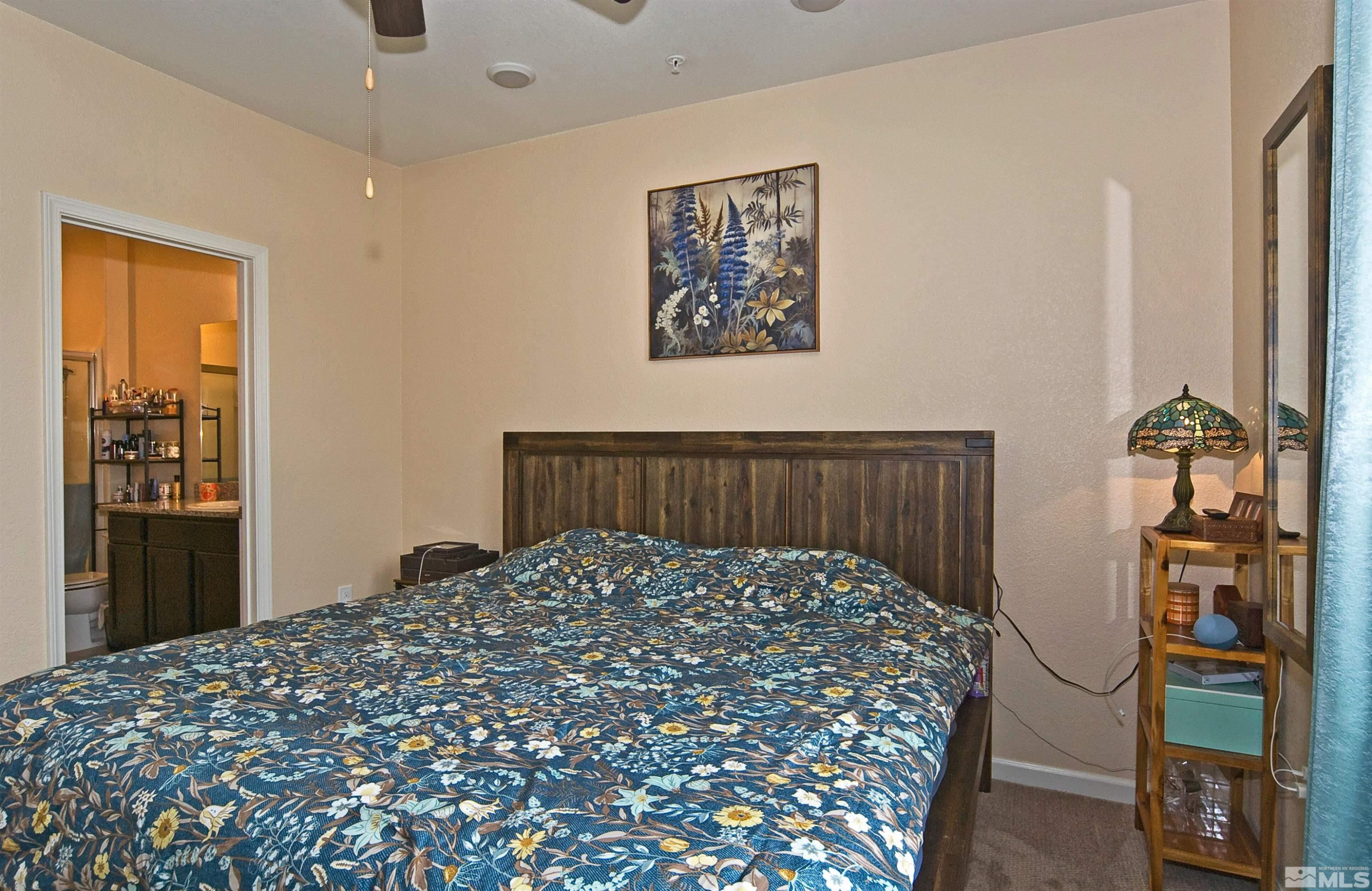 3006 Sterling Ridge Circle Sparks, NV 89431 - Photo 15 of 29 a large bed sitting in a bedroom next to a window