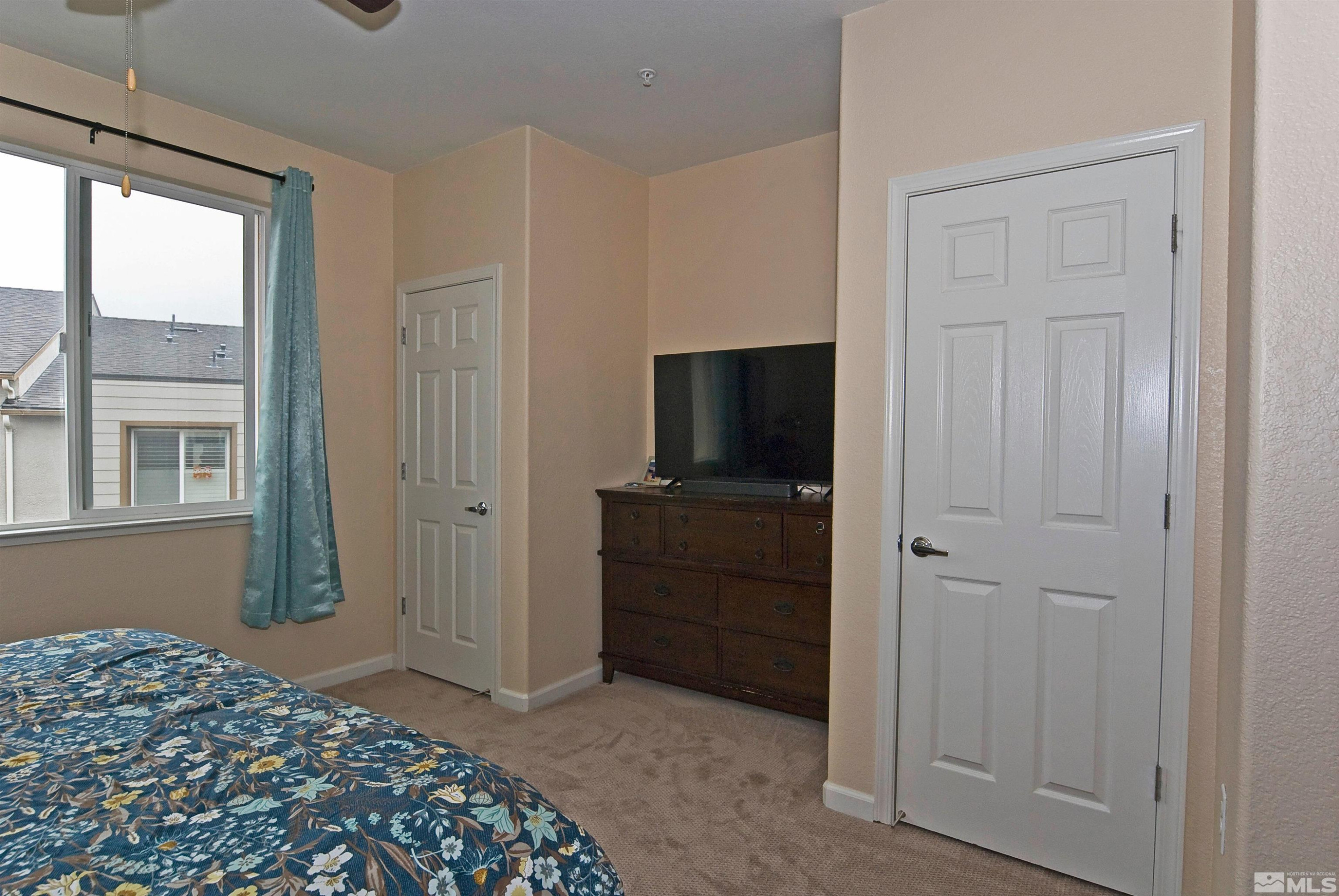 3006 Sterling Ridge Circle Sparks, NV 89431 - Photo 17 of 29 a bedroom with a bed and a television
