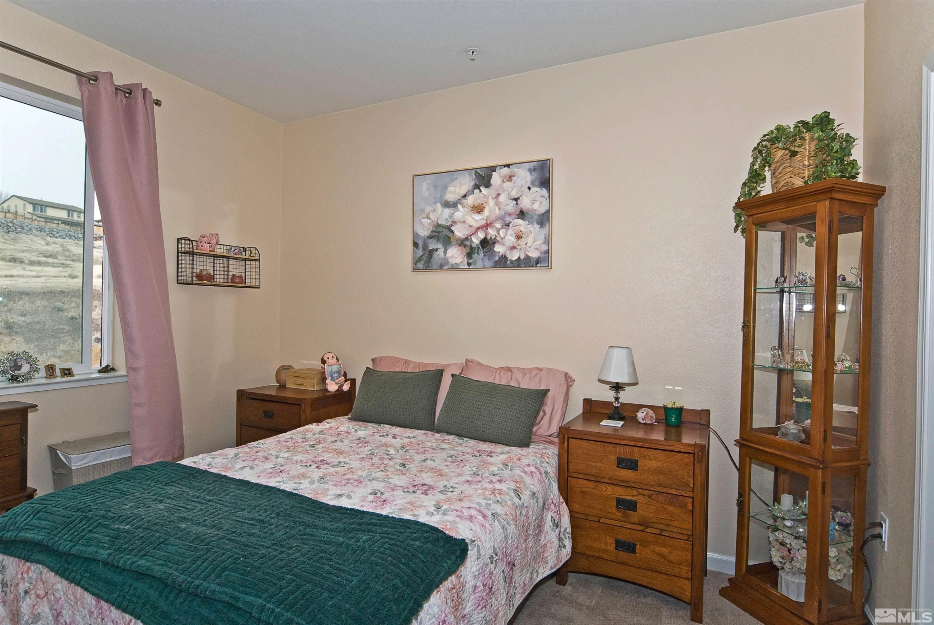 3006 Sterling Ridge Circle Sparks, NV 89431 - Photo 18 of 29 a bedroom with a bed and a window