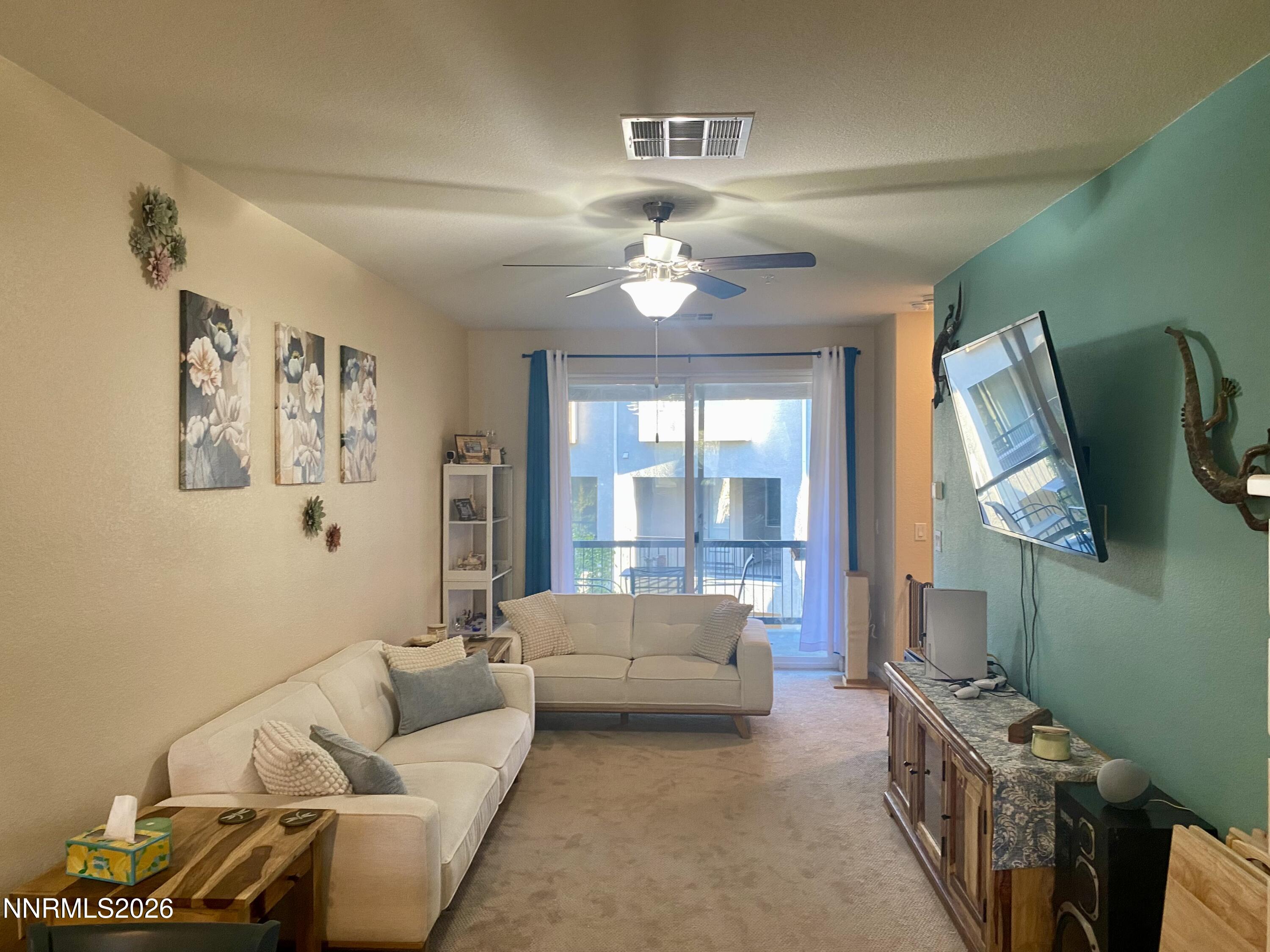 3006 Sterling Ridge Circle Sparks, NV 89431 - Photo 3 of 29 a living room with furniture and a large window
