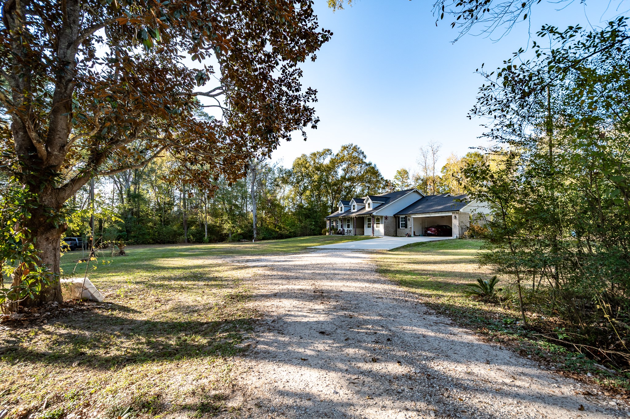 14144 Old Highway 59N Splendora, TX 77372 - Photo 13 of 24 a view of a house with a yard