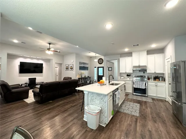 a view of a dining room with furniture and window