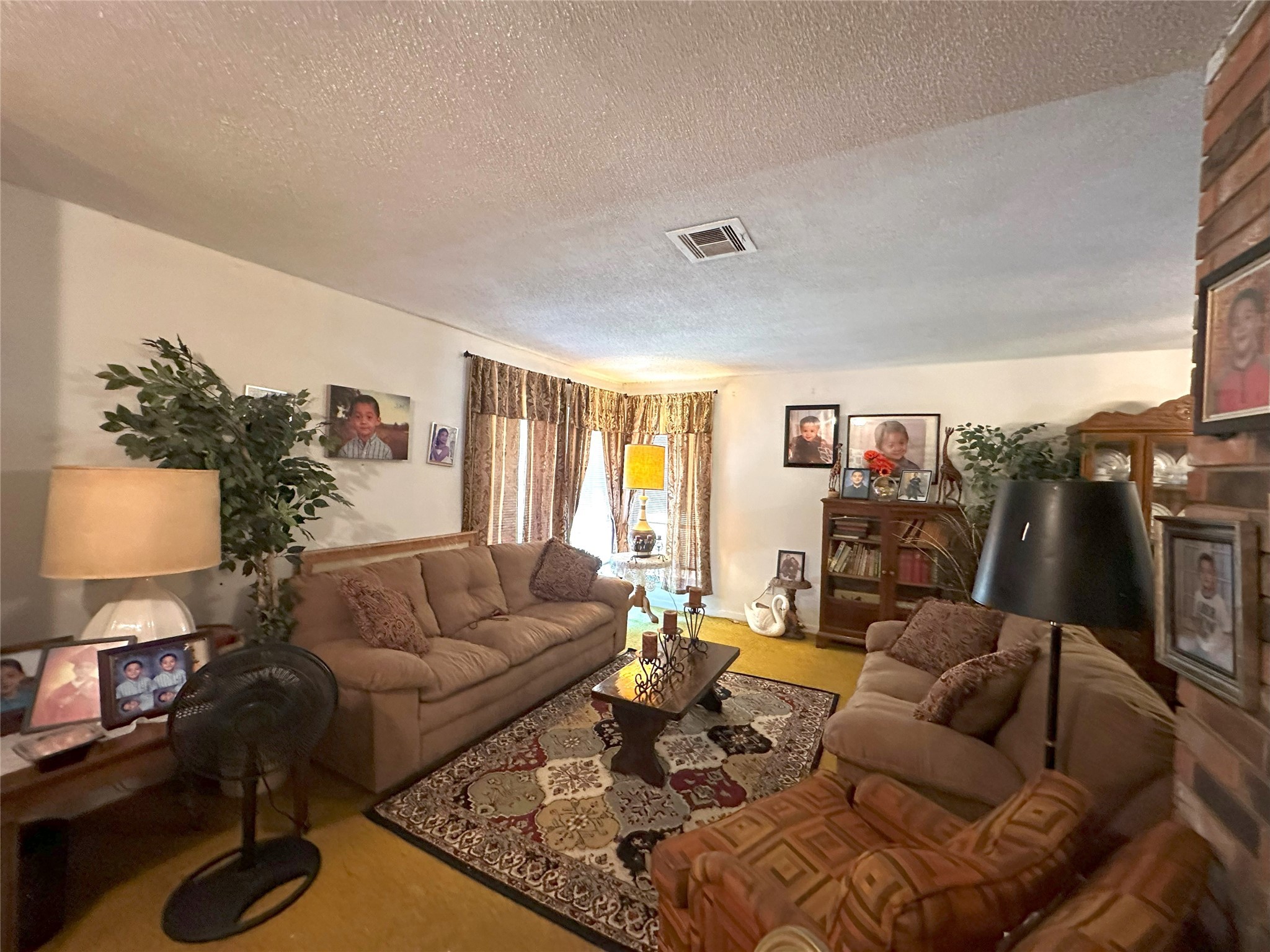 14144 Old Highway 59N Splendora, TX 77372 - Photo 4 of 24 a living room with furniture and a flat screen tv