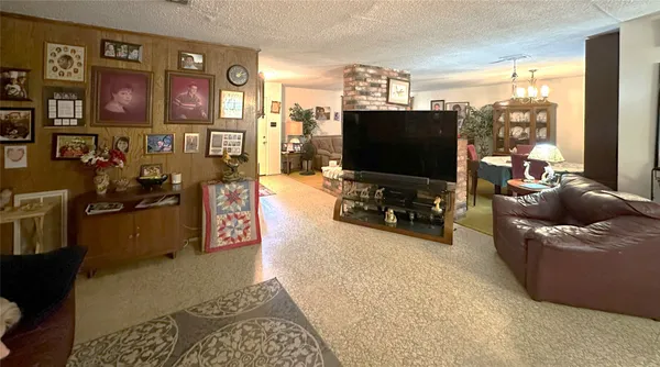 a kitchen with a sink appliances and cabinets