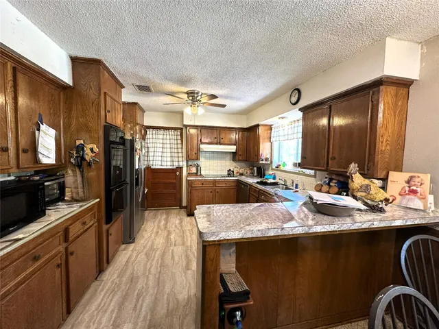 a view of a dining room with furniture wooden floor and chandelier