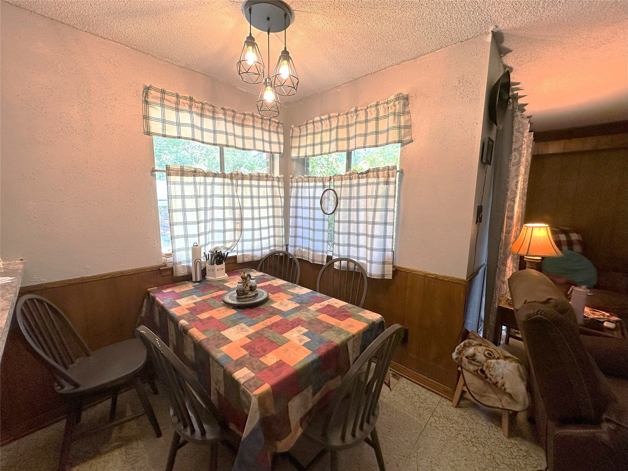 14144 Old Highway 59N Splendora, TX 77372 - Photo 7 of 24 a view of a dining room with furniture wooden floor and chandelier