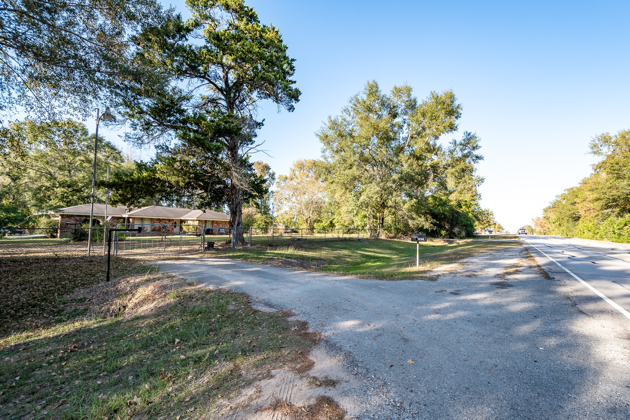 14144 Old Highway 59N Splendora, TX 77372 - Photo 9 of 24 a view of a yard with a tree