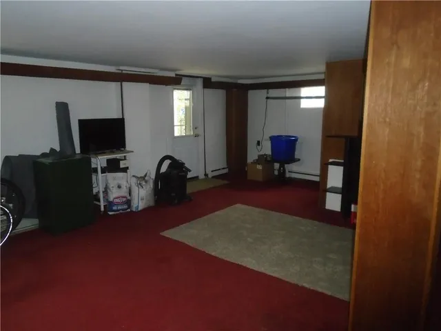 a view of a livingroom with furniture and a flat screen tv