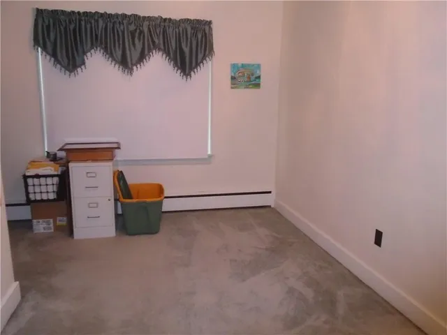 a view of storage and utility room with a window