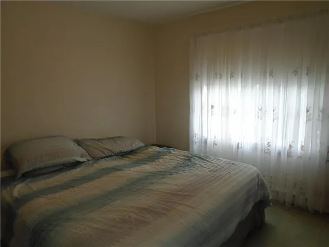 a room with furniture and a window