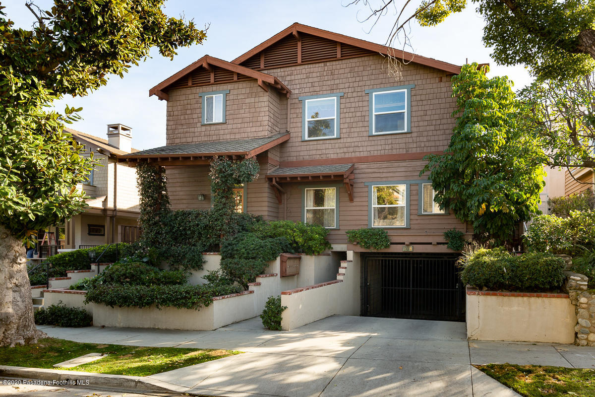 a front view of a house with yard