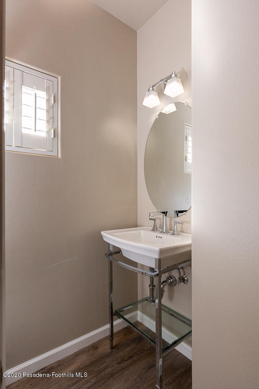 306 Alpine Street, Unit 3 Pasadena, CA 91106 - Photo 12 of 26 a view of a bathroom with a sink and a mirror