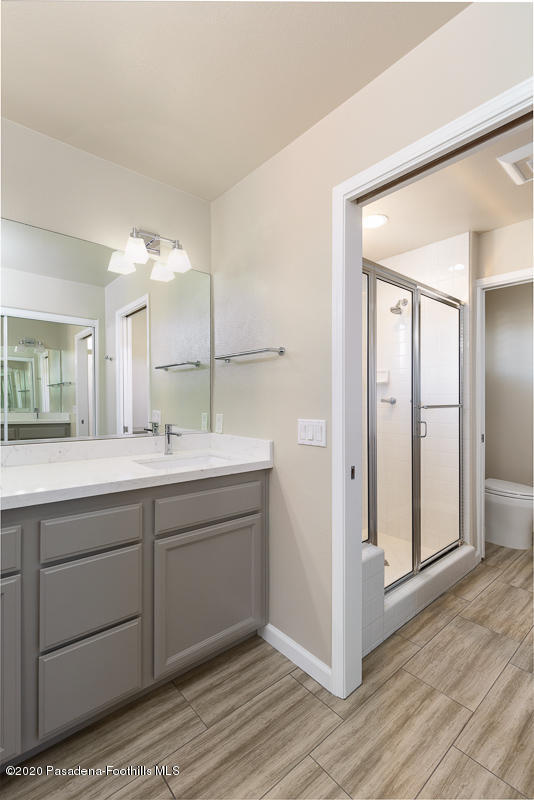 306 Alpine Street, Unit 3 Pasadena, CA 91106 - Photo 18 of 26 a bathroom with a double vanity sink and a mirror